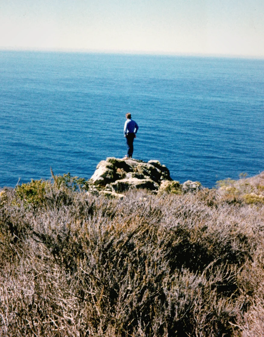 John Handy looking out over the land that would become Treebones Resort — Big Sur, 1986